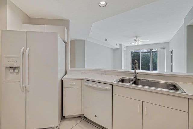 kitchen featuring ceiling fan, white appliances, light tile patterned flooring, and sink