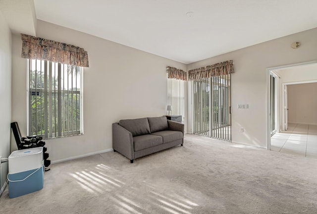 living area featuring light colored carpet