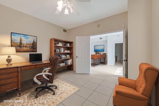 tiled office space featuring vaulted ceiling and ceiling fan