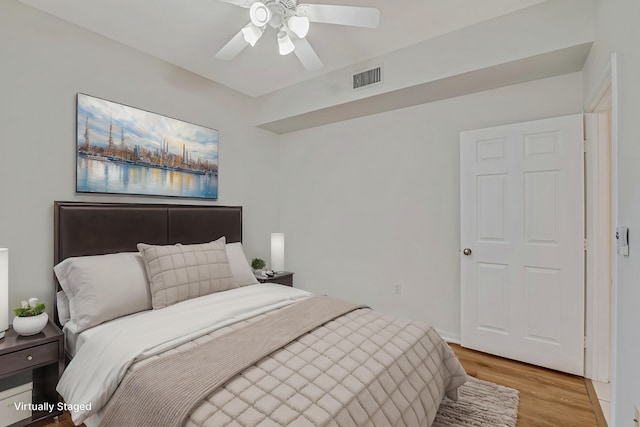 empty room featuring ceiling fan and light wood-type flooring