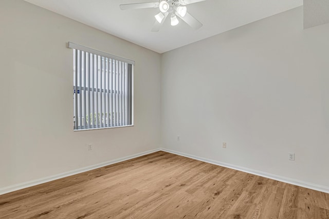 unfurnished room with light hardwood / wood-style flooring and ceiling fan