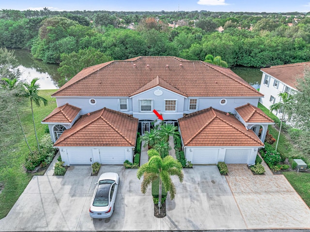 birds eye view of property featuring a water view