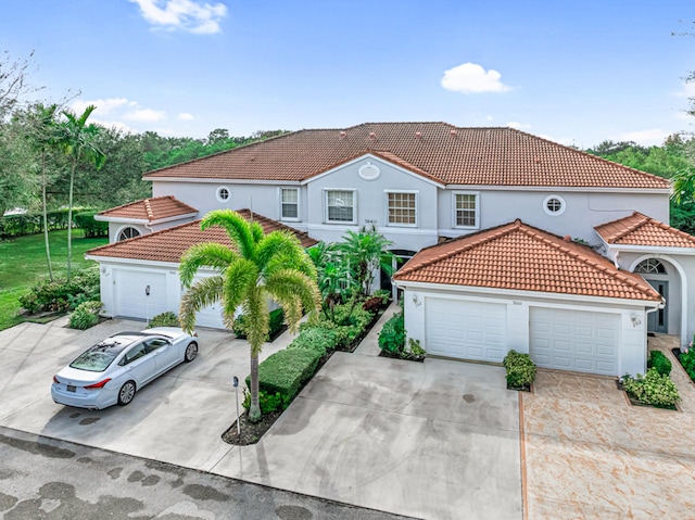 mediterranean / spanish-style home featuring a garage