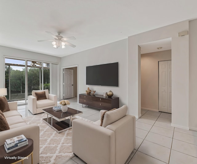 living room with ceiling fan and light tile patterned floors