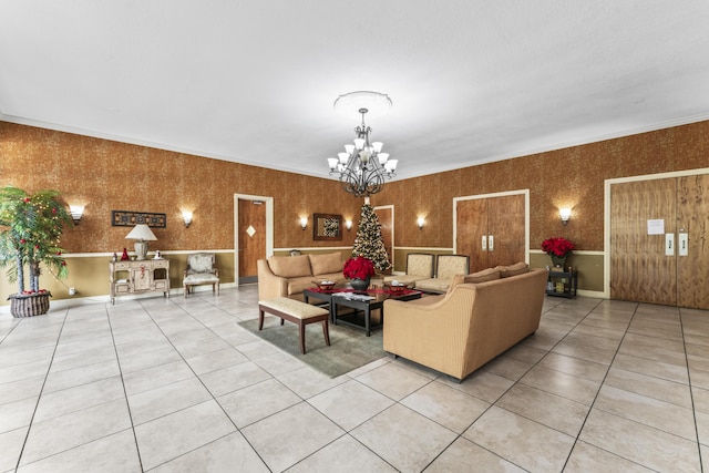 tiled living room with ornamental molding and a chandelier