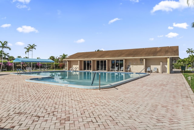 view of swimming pool featuring a patio area