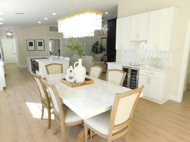 dining area featuring recessed lighting, visible vents, and light wood-type flooring