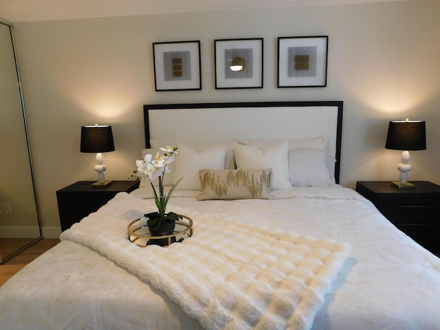 bedroom with wood finished floors