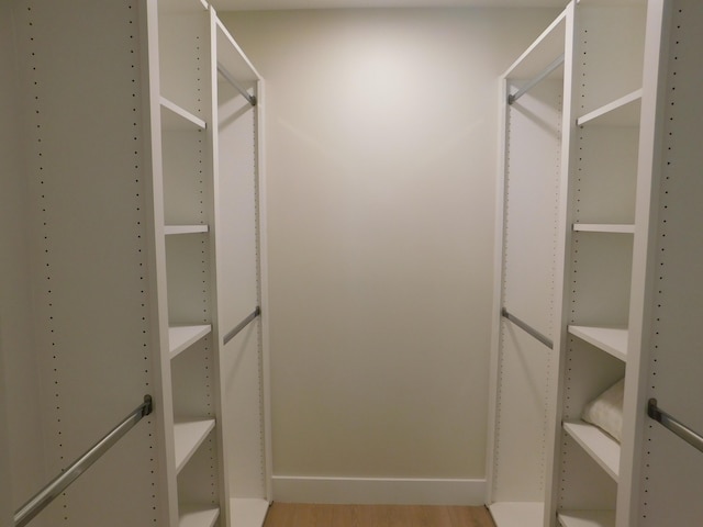 spacious closet featuring light wood-type flooring