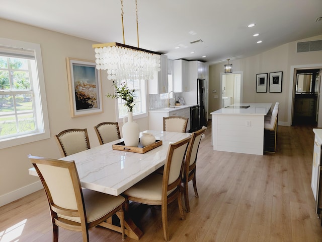 dining area with light wood finished floors, visible vents, recessed lighting, and baseboards