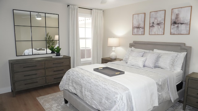 bedroom with a ceiling fan and wood finished floors