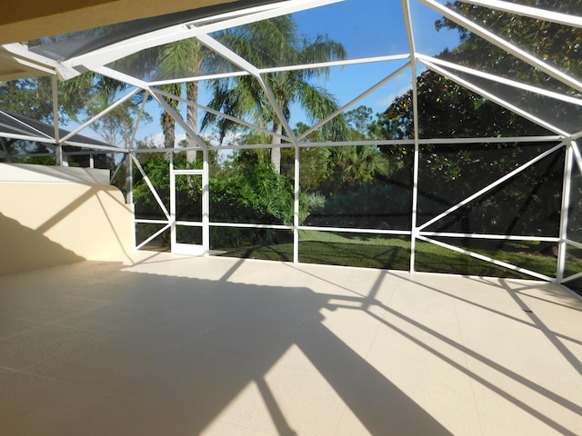 view of patio / terrace featuring a lanai