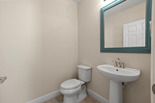 bathroom with toilet and sink