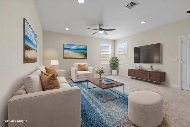 living room featuring ceiling fan and light carpet