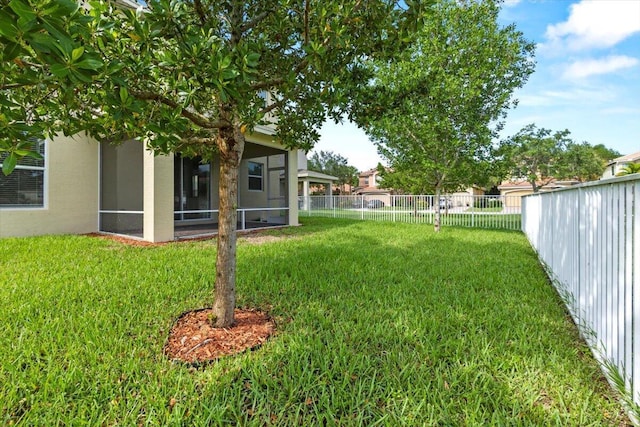 view of yard with a sunroom