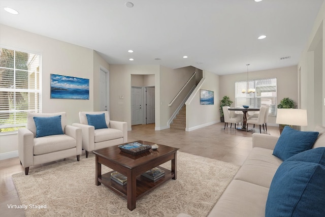 living room with an inviting chandelier