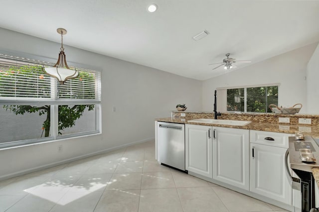 kitchen with sink, hanging light fixtures, stainless steel appliances, vaulted ceiling, and white cabinets