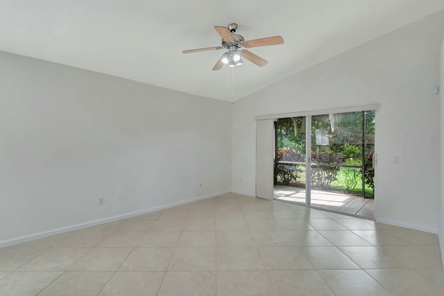 spare room with light tile patterned floors, vaulted ceiling, and ceiling fan