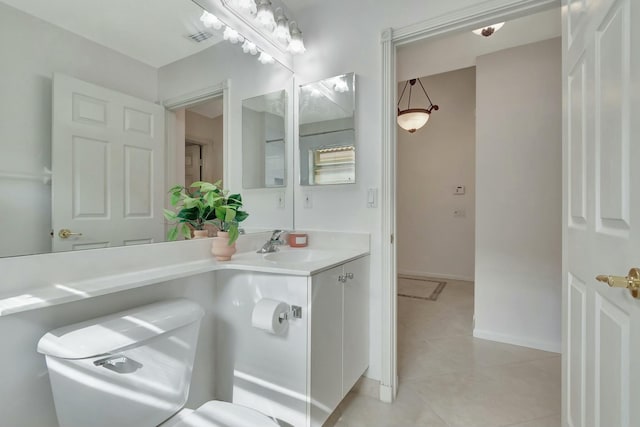 bathroom with tile patterned floors and vanity