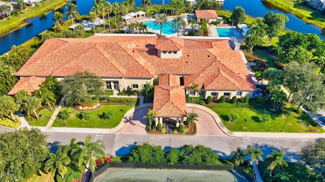 birds eye view of property with a water view