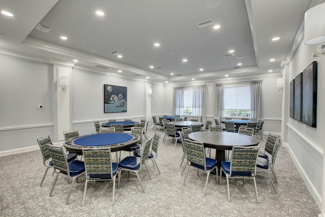 dining area featuring a raised ceiling