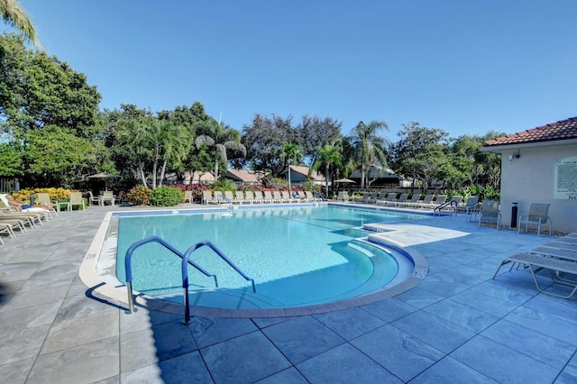 view of swimming pool with a patio