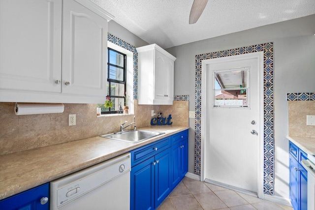 kitchen featuring white cabinets, a textured ceiling, sink, blue cabinetry, and dishwasher