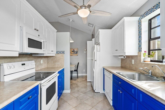 kitchen with sink, blue cabinets, vaulted ceiling, white appliances, and light tile patterned flooring