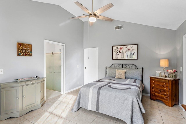 tiled bedroom featuring ceiling fan, ensuite bathroom, and high vaulted ceiling