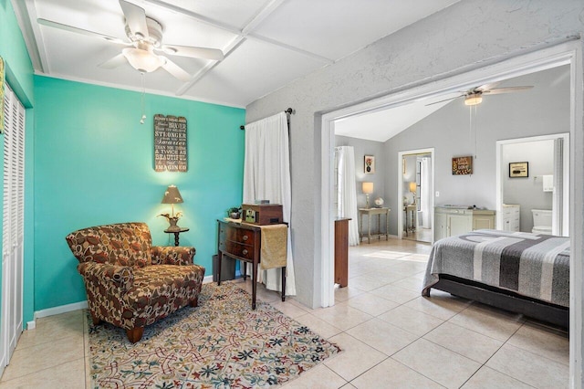 bedroom with ceiling fan, light tile patterned floors, and lofted ceiling