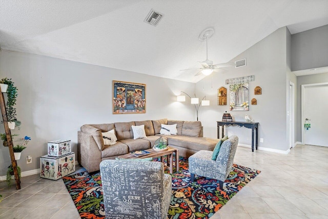 living room featuring a textured ceiling, ceiling fan, light tile patterned floors, and lofted ceiling