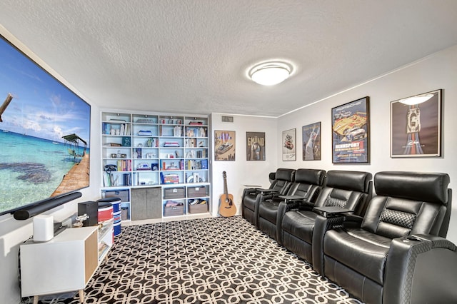 carpeted home theater room featuring a textured ceiling