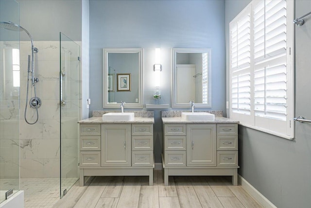 bathroom featuring vanity and a tile shower