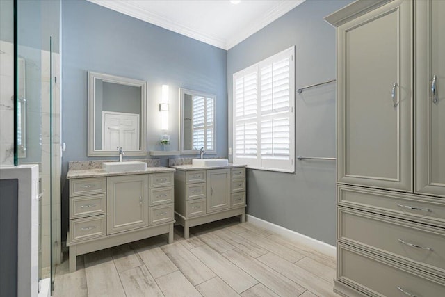 bathroom featuring ornamental molding and vanity