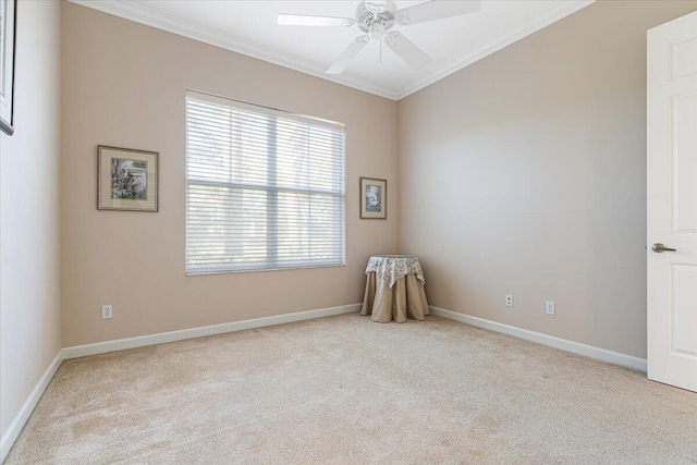 carpeted empty room with ornamental molding and ceiling fan