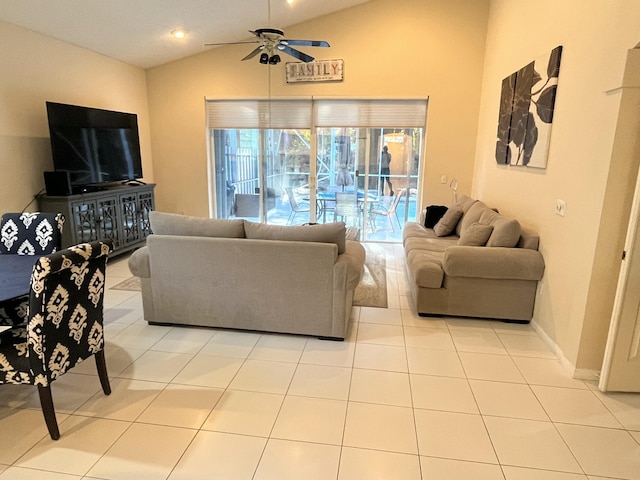 living room featuring lofted ceiling, light tile patterned floors, and ceiling fan