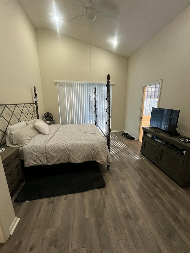 bedroom with lofted ceiling, dark wood-type flooring, and ceiling fan