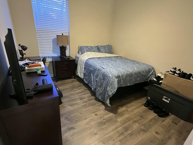 bedroom with hardwood / wood-style floors