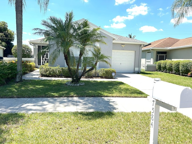 ranch-style home with a garage and a front yard