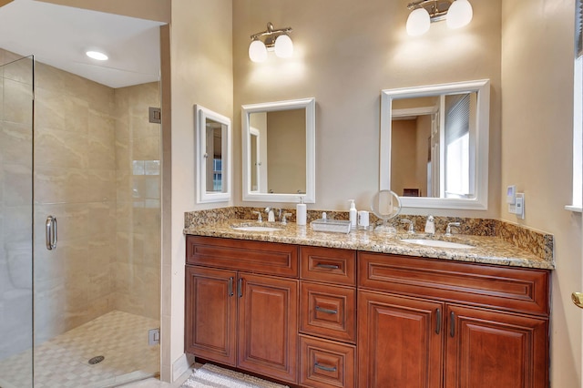 bathroom featuring vanity, tile patterned flooring, and a shower with door