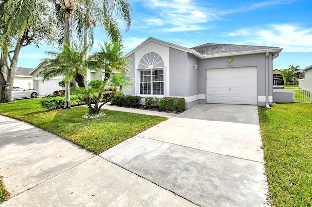 ranch-style house with a front lawn and a garage