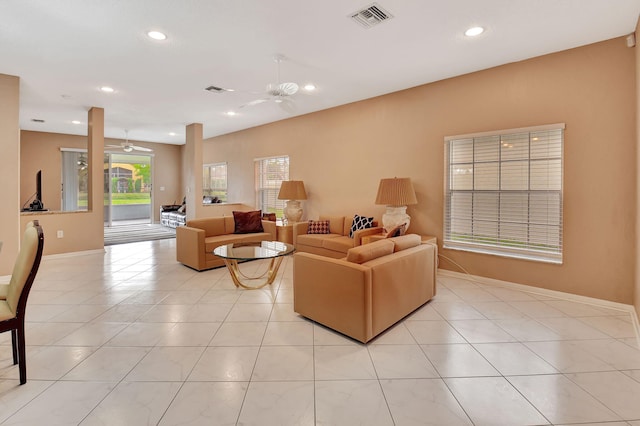 living room with ceiling fan and light tile patterned floors