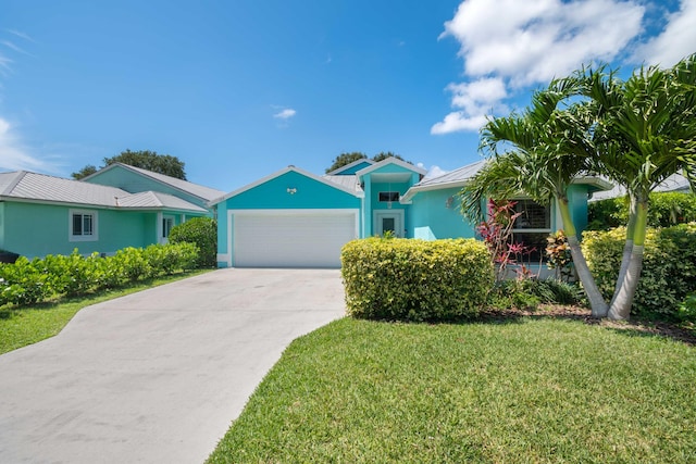 single story home with a front yard and a garage