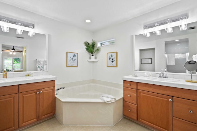 bathroom with plus walk in shower, vanity, tile patterned floors, and ceiling fan