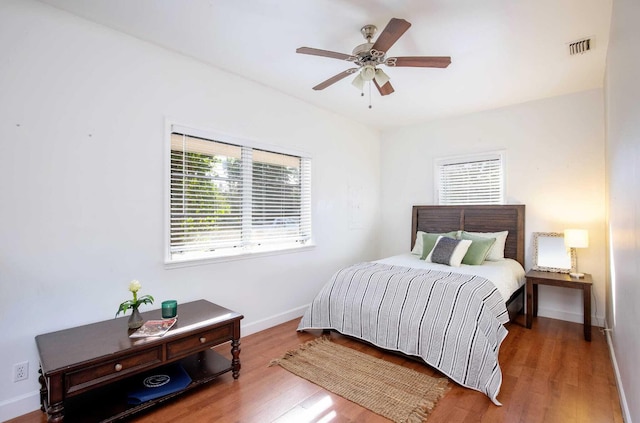 bedroom featuring hardwood / wood-style floors and ceiling fan