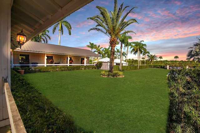 view of yard at dusk