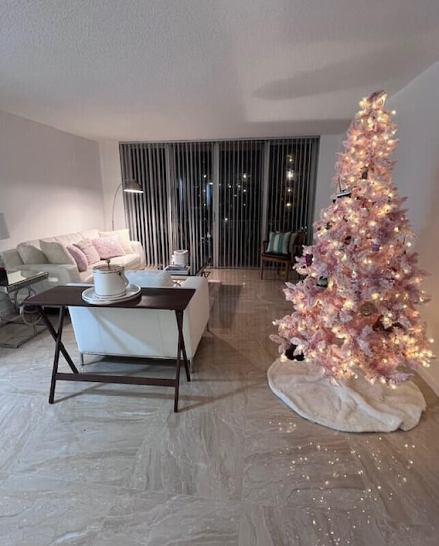 unfurnished living room featuring a textured ceiling