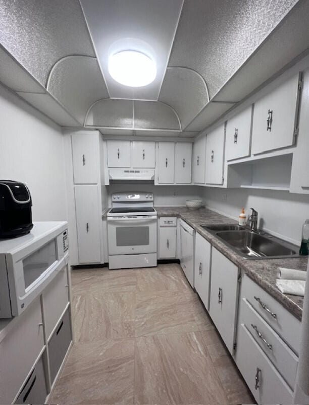 kitchen with white cabinets, white appliances, and sink