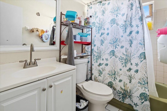 full bathroom featuring vanity, toilet, and shower / tub combo