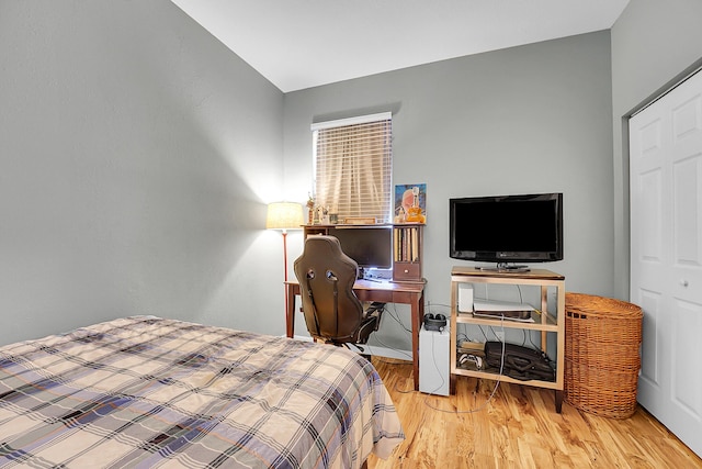 bedroom with wood finished floors